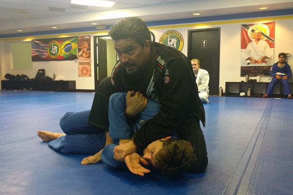 Professor John Machado demonstrates Brazilia Jiu Jitsu move in Allen Texas